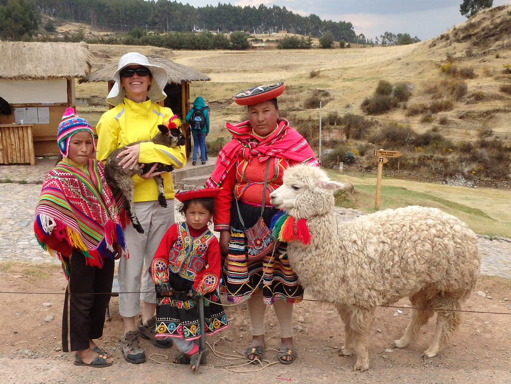 Terry Struck, Indigenous Peoples in Bright Clean Native Dress, Kids, and Baby Animals - Welcome to Cuzco, Peru.